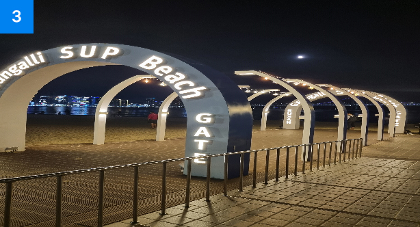 The Gwangalli SUP BEACH gate photo zone lit up at night